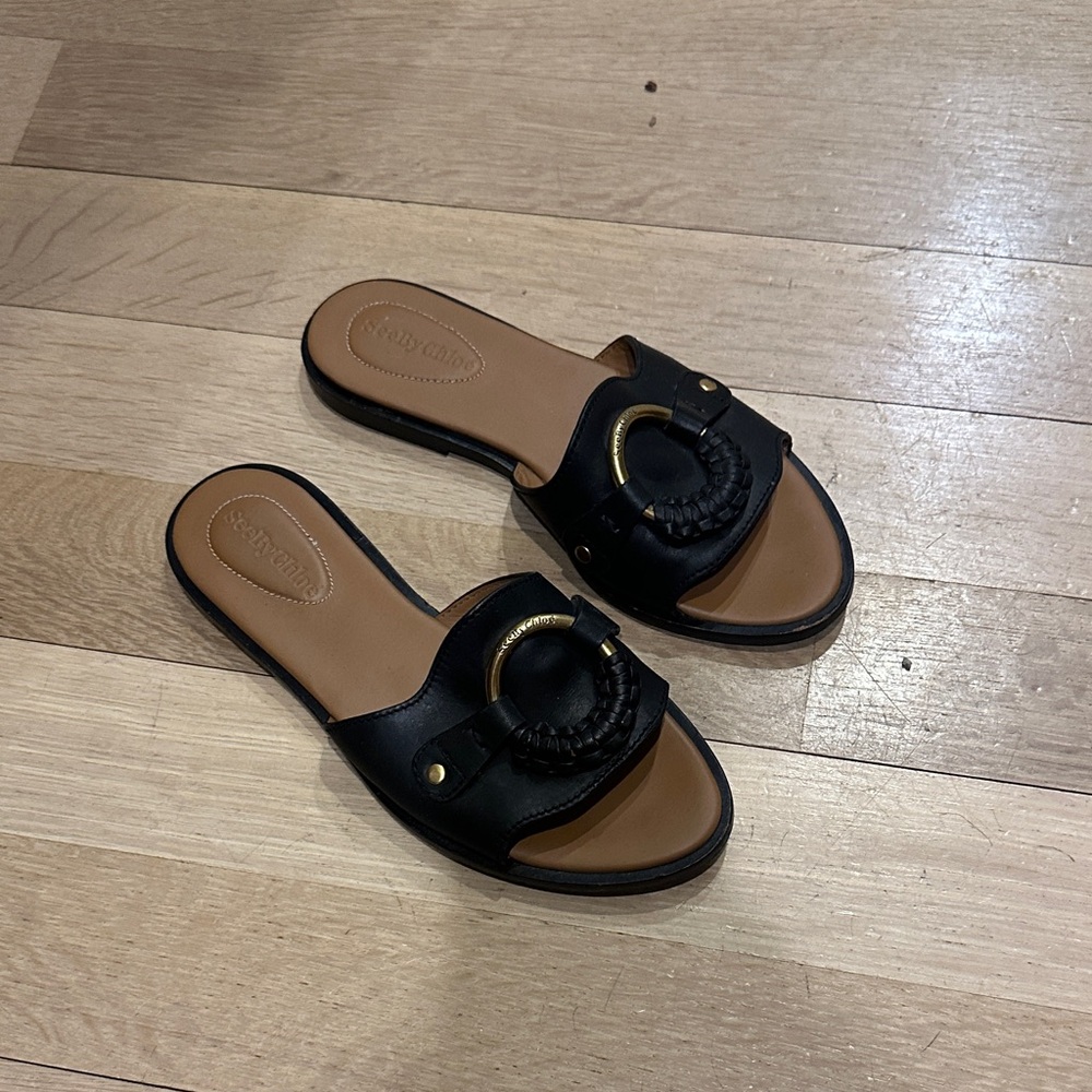 See By Chloe Black Slide Sandals with Gold Ring Detail